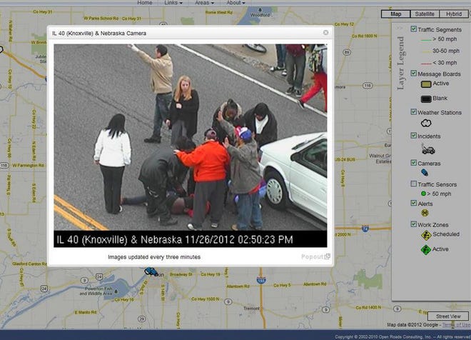 A frame grab from www.gettingaroundpeoria.com shows passersby coming to the aid of a teenager gir who was struck by a car Monday near Knoxvillle and Nebraska avenues n Peoria.