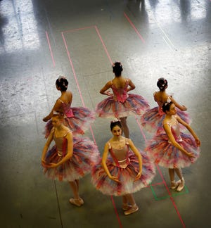 Wearing new costumes for the first time, Boston Ballet dancers rehearse for their upcoming production of "The Nutcracker," which will open Nov. 23 at the Boston Opera House.