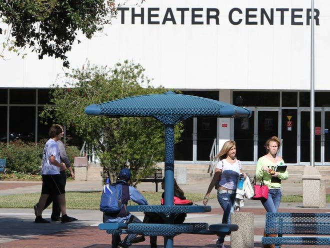 Students walking across campus Monday pass by the Theater Center at Daytona State College. The college's board meets Thursday and is expected to vote on the college's wish list for the Legislature. Among items on the list is a request for funding to knock down the Theater Center and build a larger, multistory classroom/student center in its place.