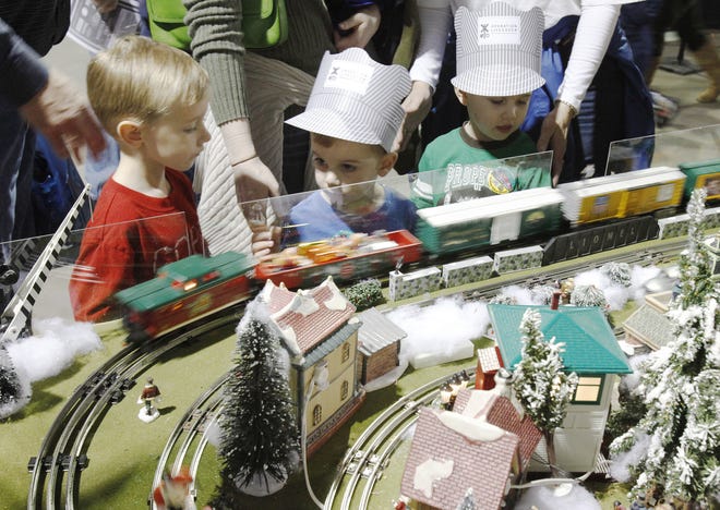 Parker Thornton, left, Jacob Thornton and Peter Craig watch the trains during the Oklahoma City Train Show in 2010.