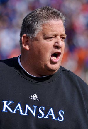Kansas head coach Charlie Weis yells at the officials during the second half of his NCAA college football game against Texas in Lawrence, Kan., Saturday, Oct. 27, 2012. (AP Photo/Reed Hoffmann)