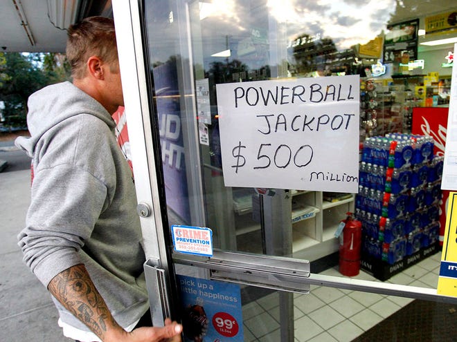 A man walks into the Kwik Stop Texaco on SW 13th Street, in Gainesville on Tuesday. The Florida Powerball jackpot is expected to surpass $500 million before the next drawing Wednesday evening.