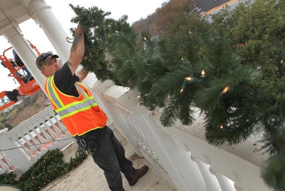 (Photo by Mike Hensdill/The Gaston Gazette) Crews continue to work on putting out Christmas decorations in McAdenville Tuesday afternoon as they worked on stalling garland and wreathes around the top of the Pharr Yarns' bell tower. Here, Steve Braswell works with the garland high atop McAdenville.


Image Description - (Photo by Mike Hensdill/The Gaston Gazette) Crews continue to work on putting out Christmas decorations in McAdenville Tuesday afternoon as they worked on stalling garland and wreathes around the top of the Pharr Yarns' bell tower. Here, Steve Braswell works with the garland high atop McAdenville.