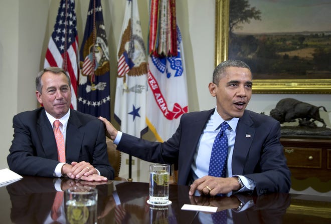 FILE - In this Nov. 16, 2012, file photo, President Barack Obama acknowledges House Speaker John Boehner of Ohio while speaking to reporters in the Roosevelt Room of the White House in Washington, as he hosted a meeting of the bipartisan, bicameral leadership of Congress to discuss the deficit and economy. A big coalition of business groups says there must be give-and-take in the negotiations to avoid the "fiscal cliff" of massive tax hikes and spending cuts. But the coalition also says raising tax rates is out of the question. The group doesn't care that President Barack Obama campaigned to raise tax rates on the rich. The same song is sung by groups representing retirees, colleges and countless others. (AP Photo/Carolyn Kaster, File)