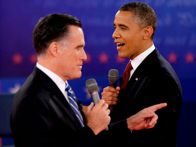 President Barack Obama and Republican presidential candidate, former Massachusetts Gov. Mitt Romney exchange views during the second presidential debate at Hofstra University in Hempstead, N.Y. in this file photo. the president has invited his former political rival to discuss issues over lunch. (AP Photo/David Goldman, File)