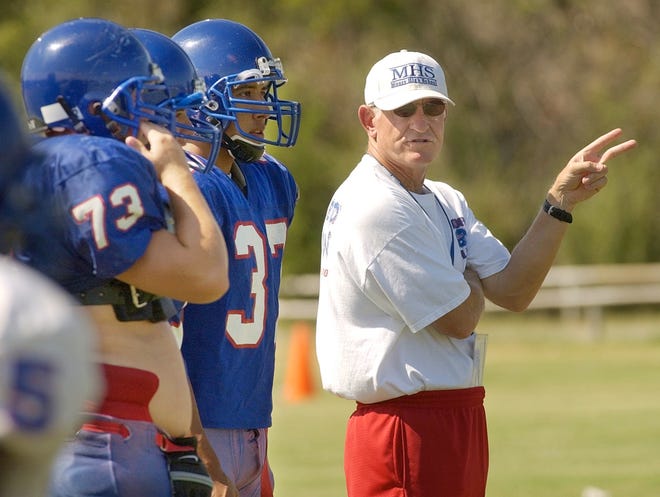 Moore head football coach Tom Noles gives instructions to his players during practice at Moore High School in 2002. Staff photo by Nate Billings, The Oklahoman Archives.