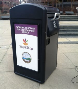 Stop and Shop president Joe Kelley and Quincy Mayor Thomas Koch introduced a new trash program that will be implemented in Quincy Center. Ten "big belly" solar powered trash compactors will be placed around the area. Each compactor can hold five times as much trash as the average barrel.