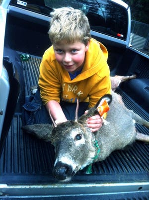 Ten-year-old Scott Kinnear of Sault Ste. Marie shot his
first buck this year on Nov. 17 with his Mom's 30-30
rifle.