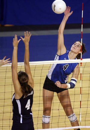Washburn Rural's Erika Lane, right, despite primarily filling the role of setter, had 10 kills in the 2012 championship match.