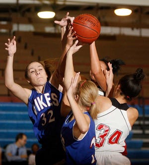 Tatiana Schafer, left, averaged 5 points and 5.3 rebounds last year for Seaman.