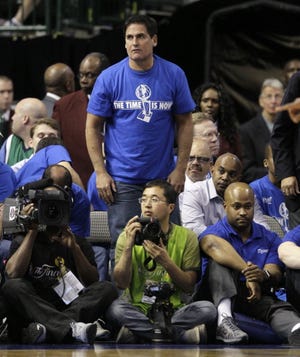 In this file photo, Dallas Mavericks owner Mark Cuban reacts during the first half of Game 3 of the NBA Finals basketball game against the Miami Heat Sunday, June 5, 2011, in Dallas. (AP Photo)