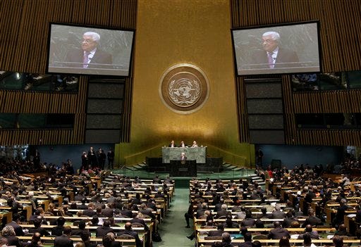 Palestinian President Mahmoud Abbas acknowledges applause before he addresses the United Nations General Assembly, Thursday, Nov. 29, 2012. In a statement Thursday, Abbas appealed to all nations to vote in favor of the Palestinians "as an investment in peace. (AP Photo/Richard Drew)