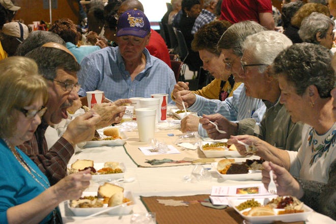 Seniors enjoy their meal at the Iberville Council on Aging’s 26th Annual Thanksgiving Luncheon on Nov. 20 at the Carl F. Grant Civic Center. The event attracted approximately 600. 
POST SOUTH PHOTO/Peter Silas Pasqua
