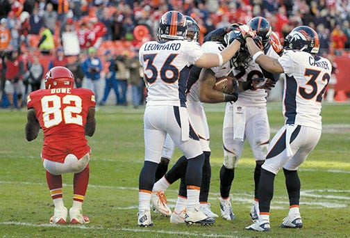 Closing in on the AFC West title, the Broncos have had reason to celebrate, including Sunday after free safety David Bruton intercepted a pass intended for Chiefs wide receiver Dwayne Bowe (82), but they still plan to take it ‘one game at a time.’
