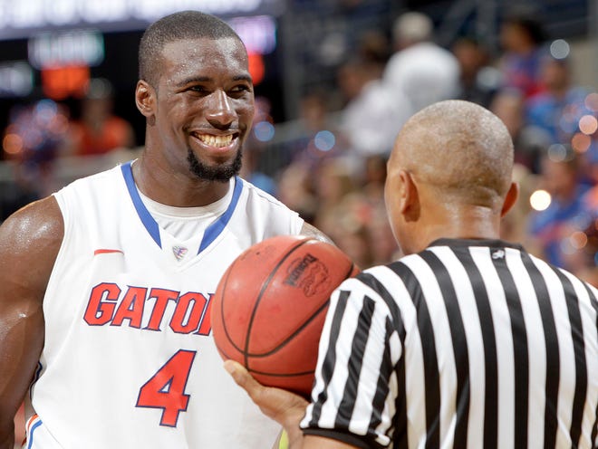 Florida center Patric Young smiles while talking to a referee during the Gators' game against Marquette on Thursday at the Stephen C. O'Connell Center.