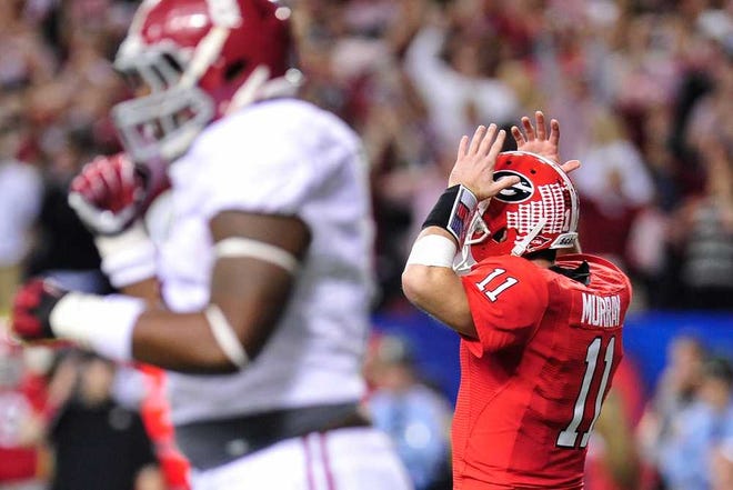 Georgia quarterback Aaron Murray (11) reacts after an incomplete pass during the Bulldogs' 32-28 loss to Alabama on Saturday at the Georgia Dome. Murray was 18-of-33 for 265 yards with one touchdown and one interception.