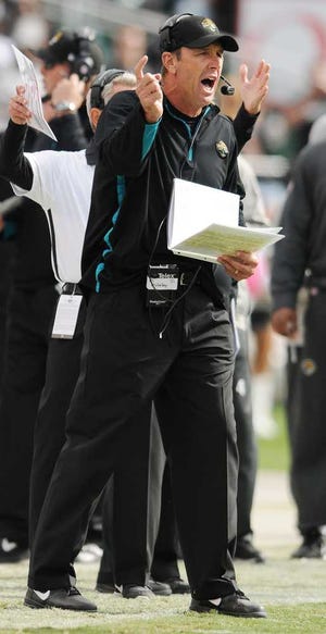 Jacksonville Jaguars head coach Mike Mularkey applauds before an NFL football game against the Houston Texans Sunday, Nov. 18, 2012, in Houston. (AP Photo/Patric Schneider)