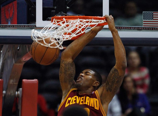 Cleveland Cavaliers forward Alonzo Gee (33) scores against the Atlanta Hawks during the first half of an NBA basketball game, Friday, in Atlanta.