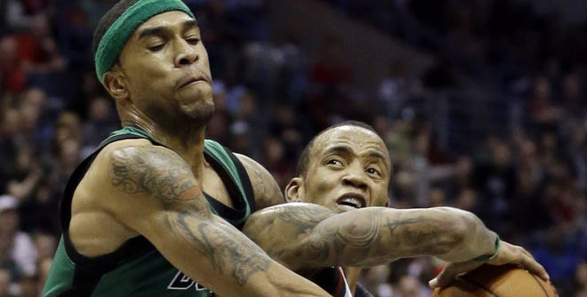 Boston's Courtney Lee fouls Milwaukee's Monta Ellis during Saturday night's game. Despite taking a 17-0 lead to open the game, the Celtics came away with a 91-88 loss to the Bucks.