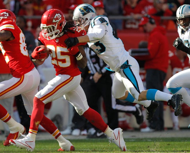 Chiefs running back Jamaal Charles is tackled by Panthers free safety Haruki Nakamura during the first half of an NFL football game at Arrowhead Stadium in Kansas City, Mo. on Sunday.