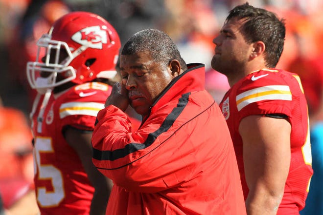 Kansas City Chiefs coach Romeo Crennel wipes his eyes Sunday before his team played the Carolina Panthers at Arrowhead Stadium. The Chiefs ended their eight-game losing streak just a day after Chiefs player Jovan Belcher killed his girlfriend Kasandra Perkins and then committed suicide.