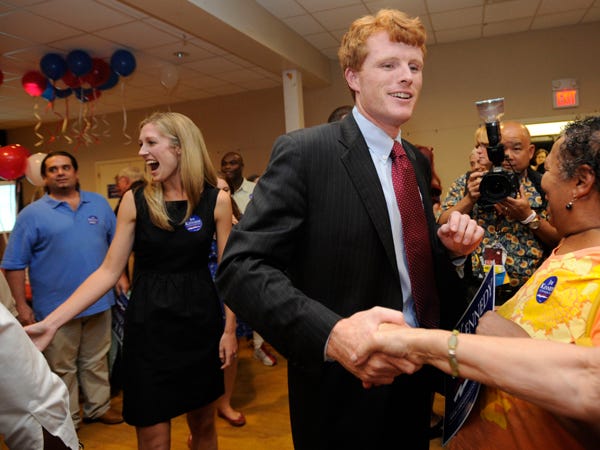 Joseph Kennedy III, son of former U.S. Rep. Joseph P. Kennedy II and grandson of the late Robert F. Kennedy, right, and his then-fiance Lauren Anne Birchfield, left, greet supporters during a primary night watch party in Taunton, Thursday, Sept. 6, 2012.