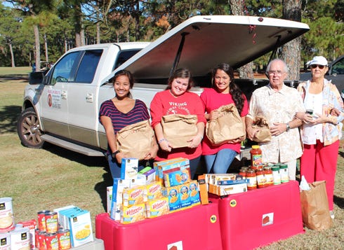 Mission Love Seeds held a food drive Sunday at Indian Bayou Country Club to support the Fort Walton Beach High School Leadership Program and its 15th annual Christmas Connections. Giana Gallegos, (from left) Angela Roy, and Phoenix Catao from Fort Walton Beach High School Leadership are pictured with supporters John and Marie Medina of Destin, who donated 12 bags of food to the food drive. Mission volunteers who helped with he event were Lisa Snuggs, Maliga Pillay and Evangeline Zamonte. The food drive has been extended to Dec. 14. Collection boxes are at Ruth’s Chris in Destin, Dollar General locations in Destin, Sandestin and Santa Rosa Beach; The Fashion Exchange on U.S. 98; and The Destin Log, 35008 Emerald Coast Parkway, Suite 501, across from Bass Pro Shops.