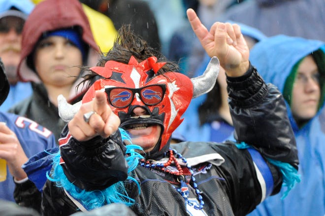 A Buffalo Bills fan cheers during the first half of an NFL football game against the Jacksonville Jaguars Sunday, Dec. 2, 2012 in Orchard Park, N.Y.