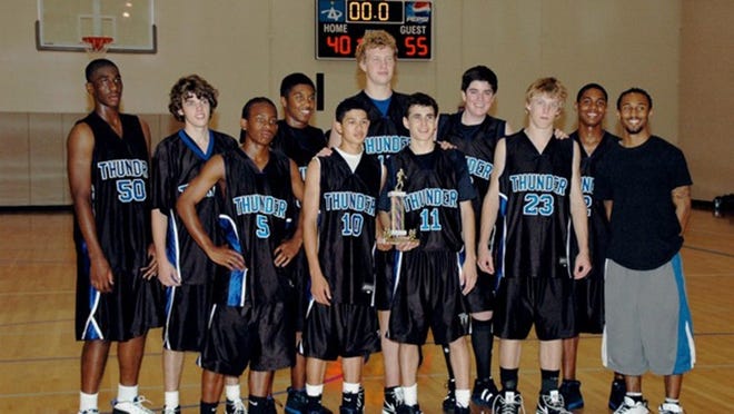 As middle-schoolers, Alex Okafor (far left), Emory Blake (third from the left, back row) and Ryan Swope (second from right, front row) played together on the Texas Thunder basketball team. Years later, all three have enjoyed successful careers in college football: Okafor at Texas; Blake at Auburn; and Swope at Texas A&M.