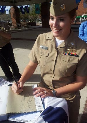 Lt. j.g. Marquette Leveque said she was inspired to join the military by the attacks of Sept. 11. She received the "dolphin" pin on Wednesday for being qualified in submarine service warfare.