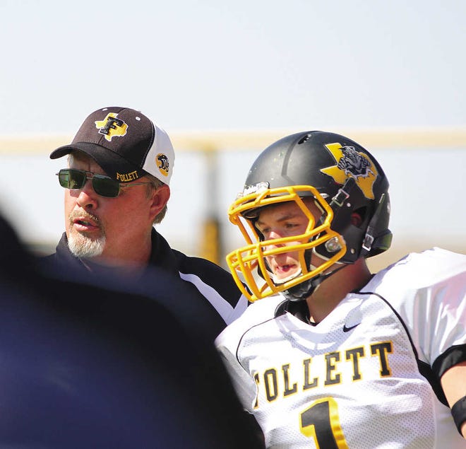 Follett coach Harley Ethridge, left, sends in a play with senior Caleb Holloway during the Happy Six-Man Kickoff Classic this season. The Follett Panthers meet the Grandfalls-Royalty Cowboys in a Six-Man Division II state semifinal Friday night.