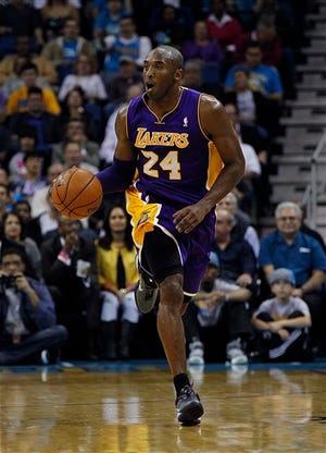 Los Angeles Lakers shooting guard Kobe Bryant (24) dribbles downcourt in the first half of an NBA basketball game against the New Orleans Hornets in New Orleans, Wednesday, Dec. 5, 2012. (AP Photo/Gerald Herbert)