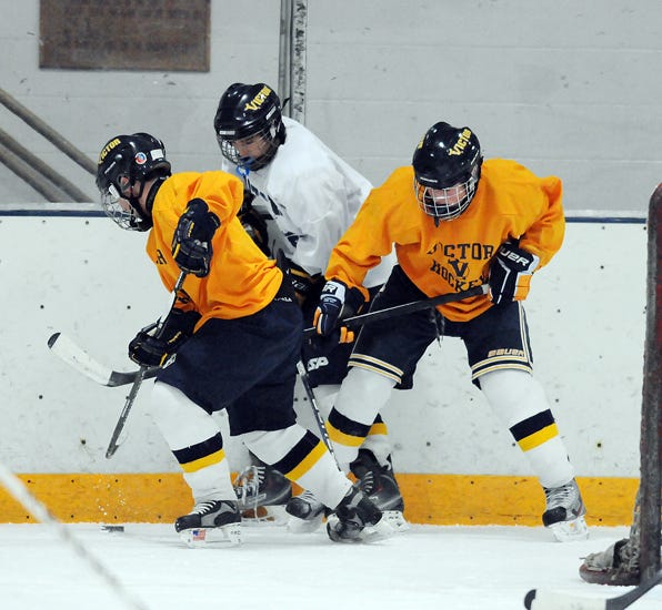 Members of the Victor hockey team practices at Thomas Creek.