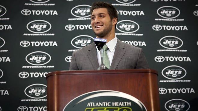 Tim Tebow speaks at a news conference after being introduced as a quarterback for the New York Jets in Florham Park, N.J., on March 26, 2012.