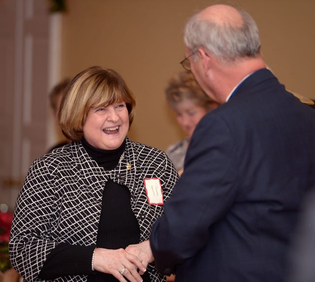 12/6/12 - Phoebe Harman talks with Burlington Kiwanian Nelson Young after he announced that Harman is the 2012 Burlington Kiwanis Citizen of the Year during a ceremony at Alamance Country Club Thursday.