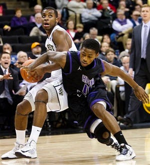 Wake Forest guard Codi Miller-McIntyre, left, draws a foul from High Point guard Haiishen McIntyre on Wednesday night.