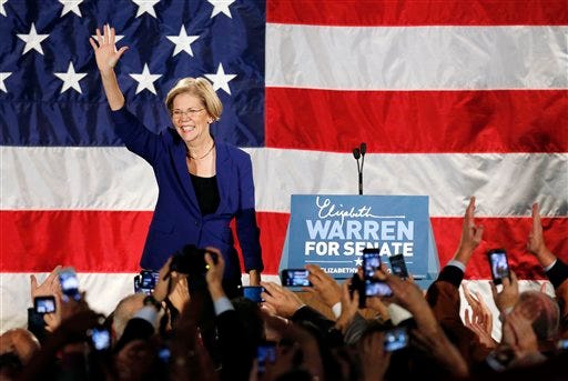 Democrat Elizabeth Warren waves to the crowd before giving her victory speech after defeating incumbent GOP Sen. Scott Brown in the Massachusetts Senate race, during an election night rally at the Fairmont Copley Plaza hotel in Boston, Tuesday, Nov. 6, 2012.