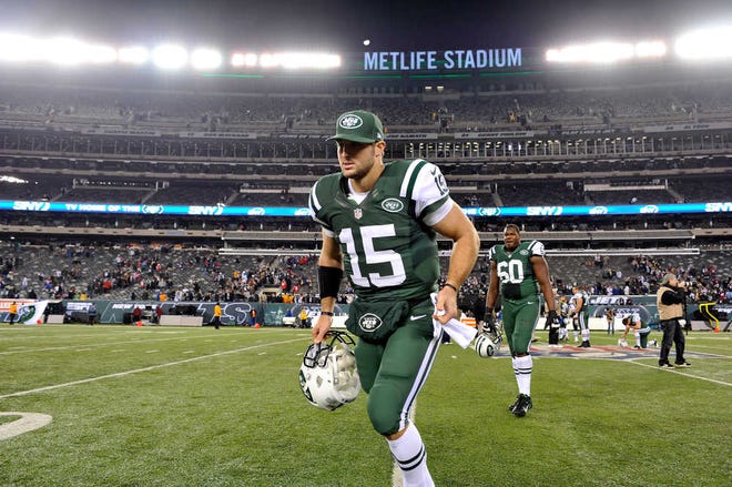 New York Jets quarterback Tim Tebow leaves the field after a game against the New England Patriots on Nov. 22.