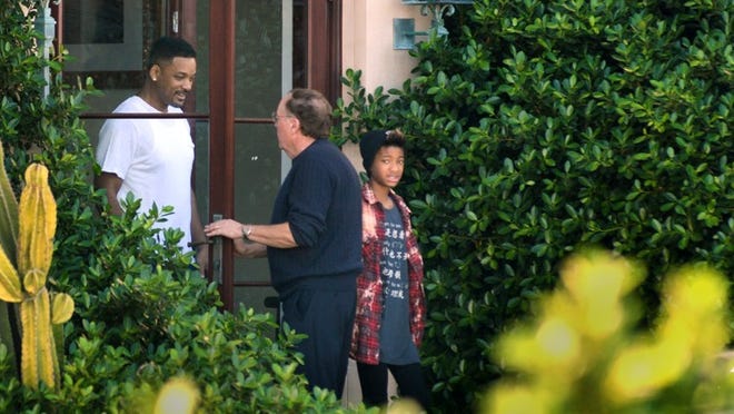 Will Smith and daughter Willow Smith are greeted by James Patterson as they leave his South Ocean Boulevard house Friday afternoon. Daily News Photo by Jeffrey Langlois