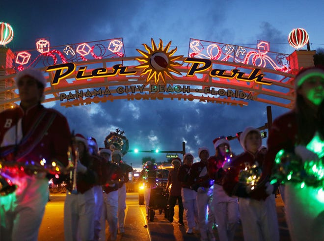 The Deane Bozeman School Band performs during the Christmas parade at Pier Park in Panama City Beach on Saturday.