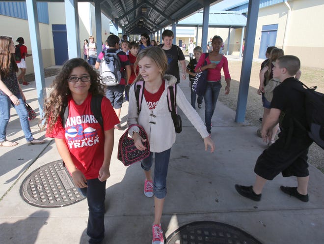 Students change classes at Howard Middle School in Ocala on Friday.