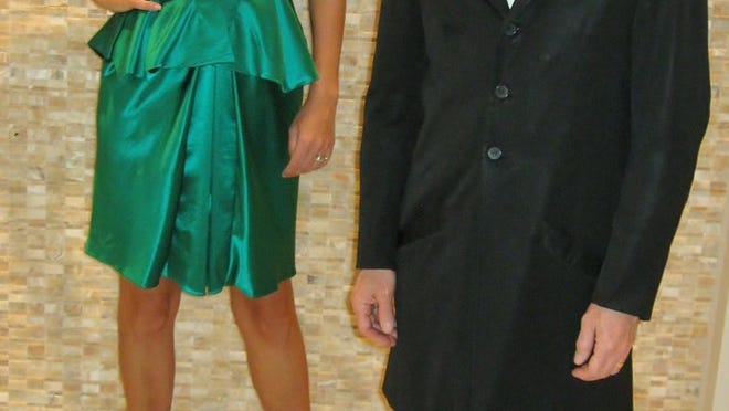 Model Paula Lauro, in an Una silk-wool-satin cocktail number, $3,960, poses with the dress’ designer, Robert Danes, at Saks Fifth Avenue.