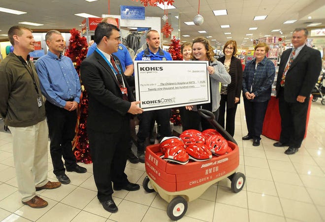 Globe-News Kohl's Assistant Store Manager Dan Butler presents a check for more than $29,000 to The Children's Hospital at Northwest Texas Healthcare System Dec. 6 at Kohl's.