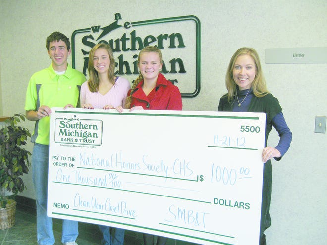 Above, left to right: Nick Waterbury, Morgan Miller, and Ellie Ohm (representing the National Honors Society), along with Sarah Asher (Southern Michigan Bank & Trust). Courtesy photo