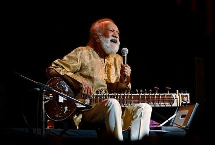 In this Feb. 7, 2012 file photo, Indian musician Ravi Shankar laughs as he speaks during a concert in Bangalore, India. Shankar, the sitar virtuoso who became a hippie musical icon of the 1960s after hobnobbing with the Beatles and who introduced traditional Indian ragas to Western audiences over an eight-decade career, has died. He was 92.