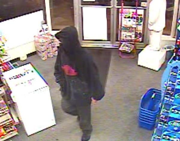 Dennis police today released a security photo from a Dennisport liquor store where a masked man robbed by knifepoint Monday night.
