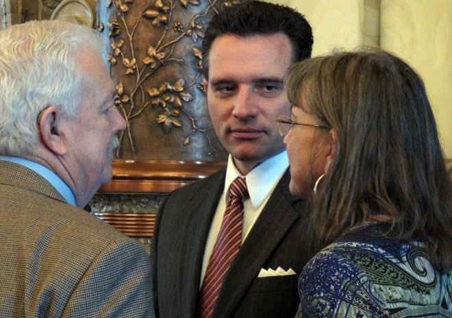 Kansas state Sens. Ray Merrick, left, of Stilwell; Ty Masterson, center, of Andover, and Susan Wagle, right, of Wichita, all Republicans, confer during a debate in March. Masterson will chair the State's budget committee in 2013.