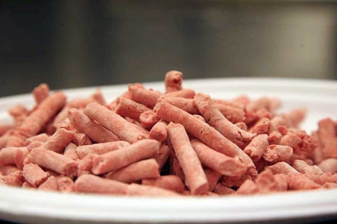 In this undated image released by Beef Products Inc., boneless lean beef trimmings are shown before packaging. The debate over "pink slime" in chopped beef is hitting critical mass. The term, adopted by opponents of "lean finely textured beef," describes the processed trimmings cleansed with ammonia and commonly mixed into ground meat. Federal regulators say it meets standards for food safety. Critics liken it to pet food _ and their battle has suddenly gone viral amid new media attention and a snowballing online petition.