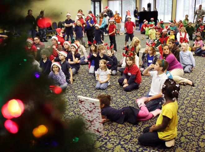 Children sing carols at a Christmas party at Naval Support Activity Panama City on Wednesday.