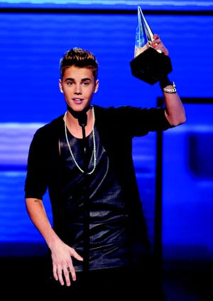 Justin Bieber accepts the award for favorite male artist - pop/rock at the 40th Annual American Music Awards on Sunday Nov. 18, 2012, in Los Angeles. (Photo by John Shearer/Invision/AP)